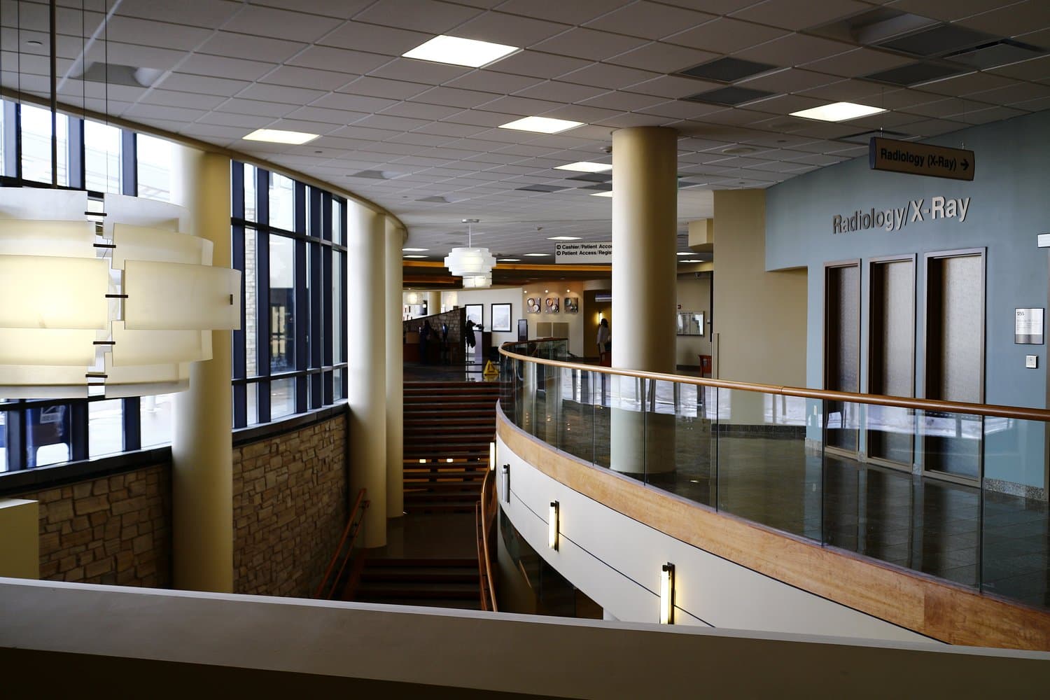 A clean, modern hospital lobby with organized waiting-area seating